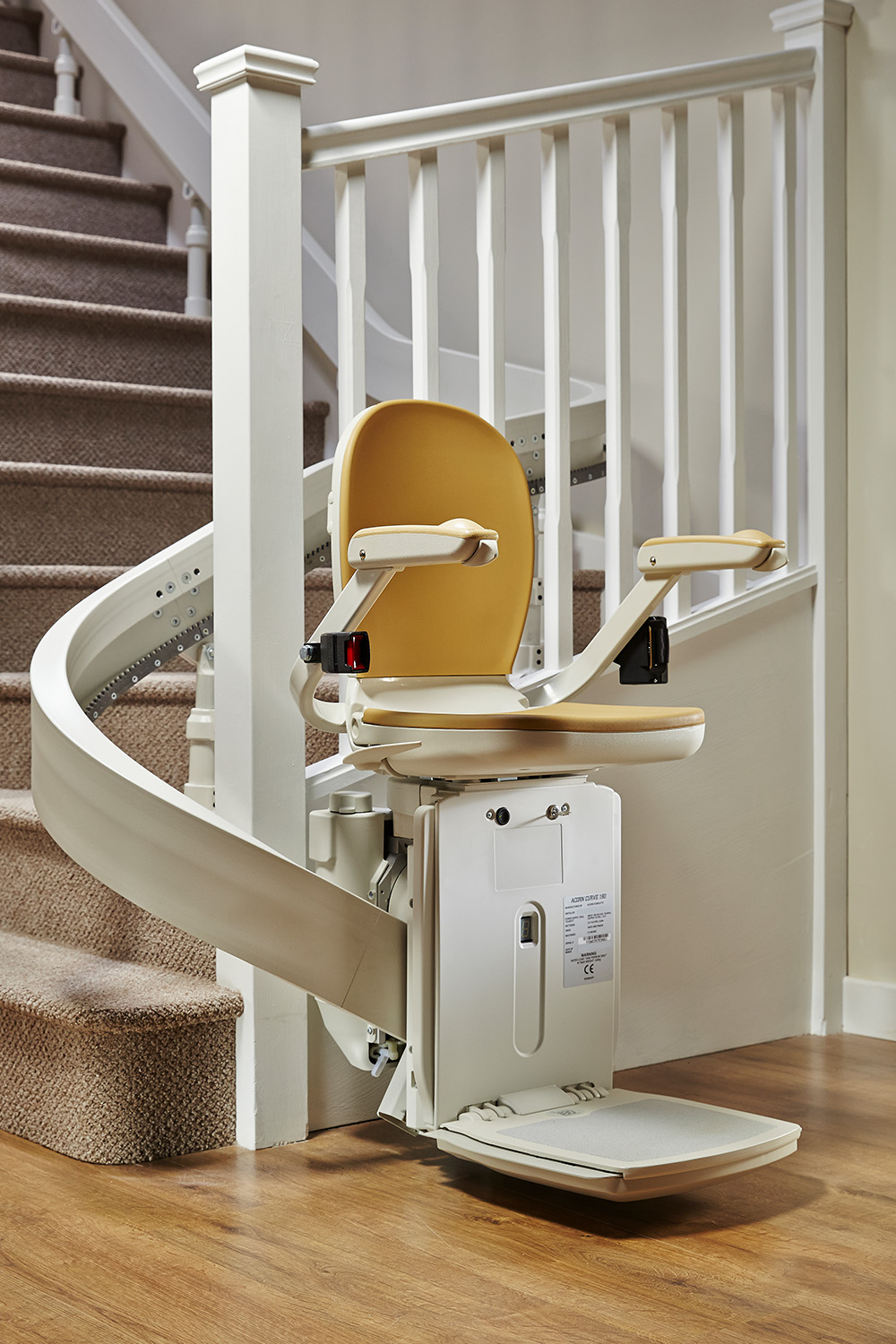 Stairlift and curved track on an indoor staircase